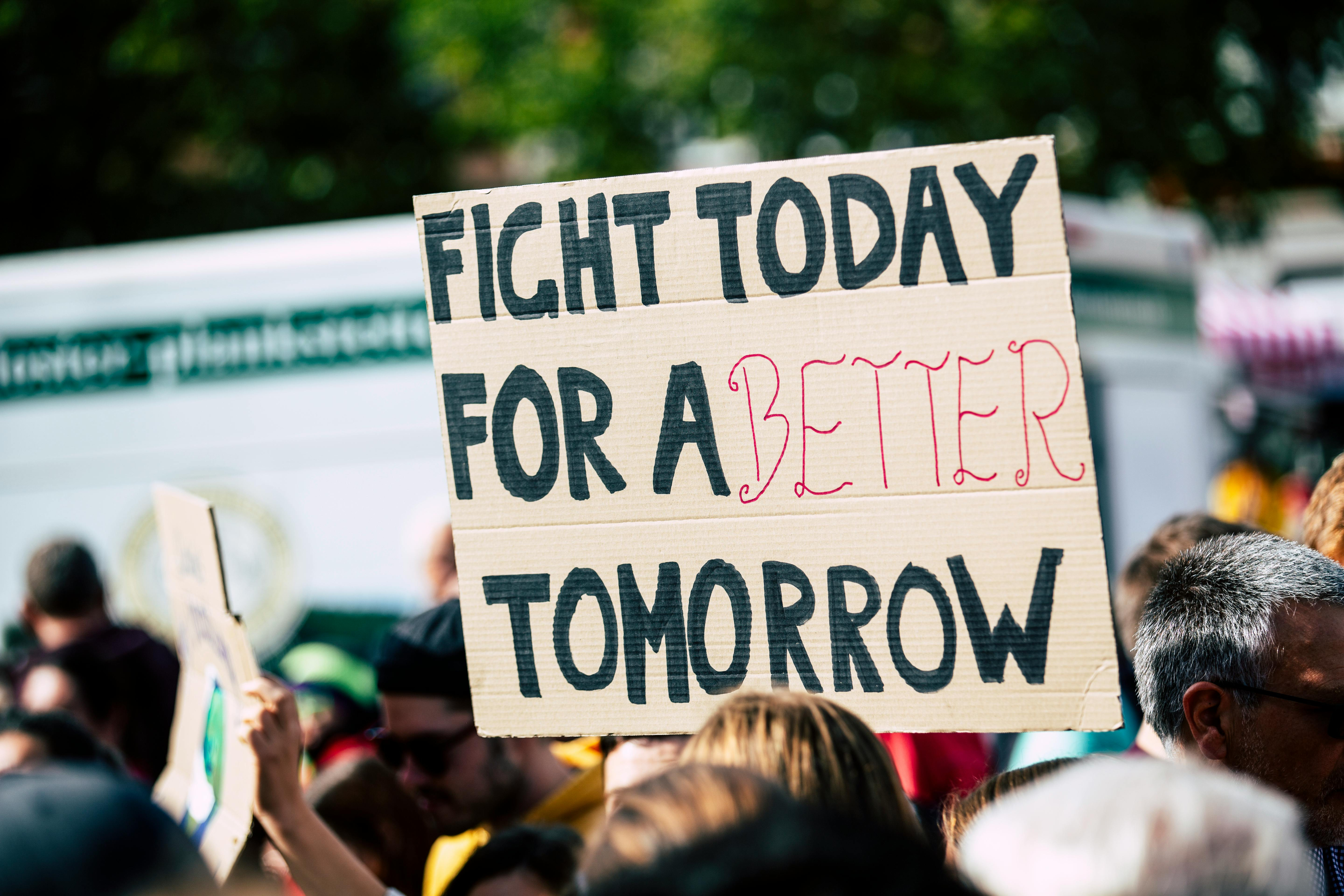 Protest sign reading Fight Today For A Better Tomorrow